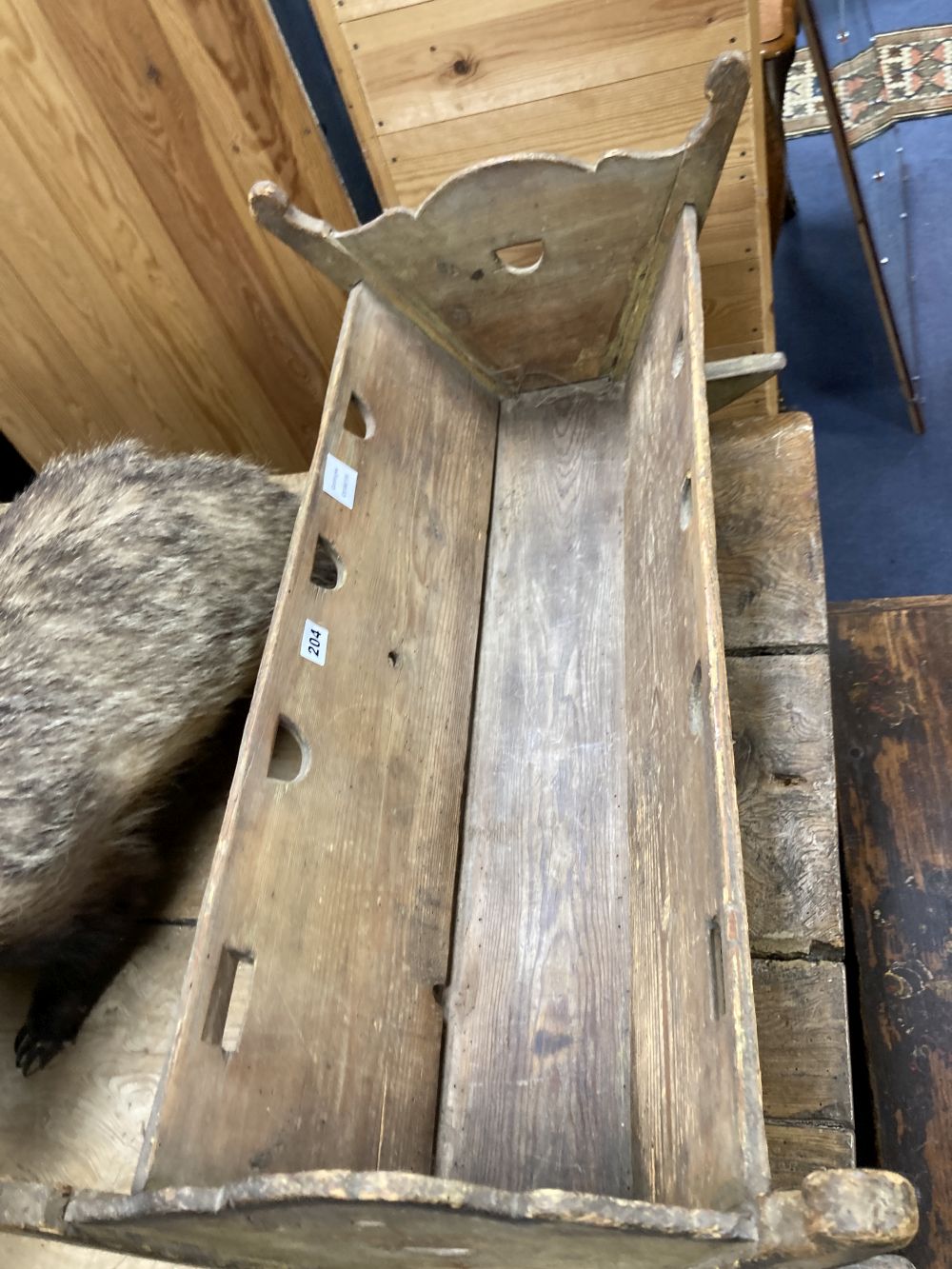 A 19th century Continental painted pine rocking crib, width 84cm depth 44cm height 36cm